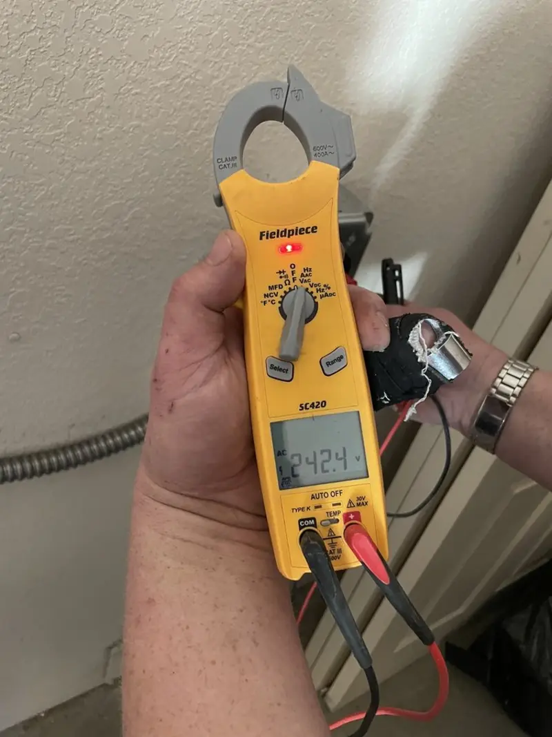 Voltage testing with clamp meter during Outlet Installation in Jenks
